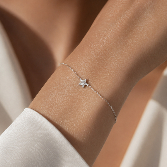 Bransoletka z zawieszką gwiazdy z białego złota z diamentami 0.08 ct - próba 585 Bransoletka z zawieszką gwiazdy z białego złota z diamentami 0.08 ct - próba 585
