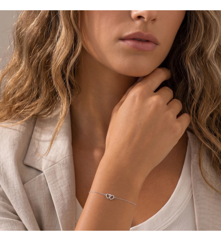 Bransoletka z zawieszką dwóch serc z białego złota z diamentami 0.08 ct - próba 585 Bransoletka z zawieszką dwóch serc z białego złota z diamentami 0.08 ct - próba 585