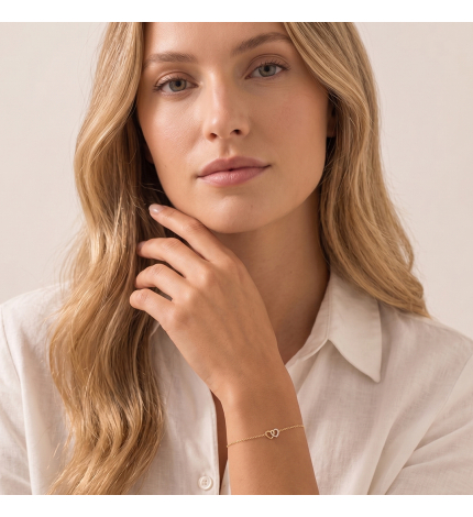 Złota bransoletka z zawieszką dwóch serc z diamentami 0.08 ct - próba 585 Złota bransoletka z zawieszką dwóch serc z diamentami 0.08 ct - próba 585