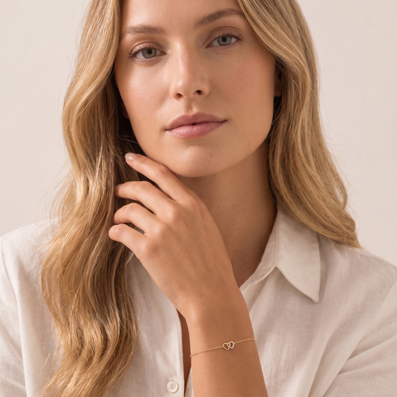 Złota bransoletka z zawieszką dwóch serc z diamentami 0.08 ct - próba 585 Złota bransoletka z zawieszką dwóch serc z diamentami 0.08 ct - próba 585