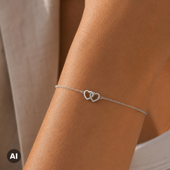 Bransoletka z zawieszką dwóch serc z białego złota z diamentami 0.08 ct - próba 585 Bransoletka z zawieszką dwóch serc z białego złota z diamentami 0.08 ct - próba 585