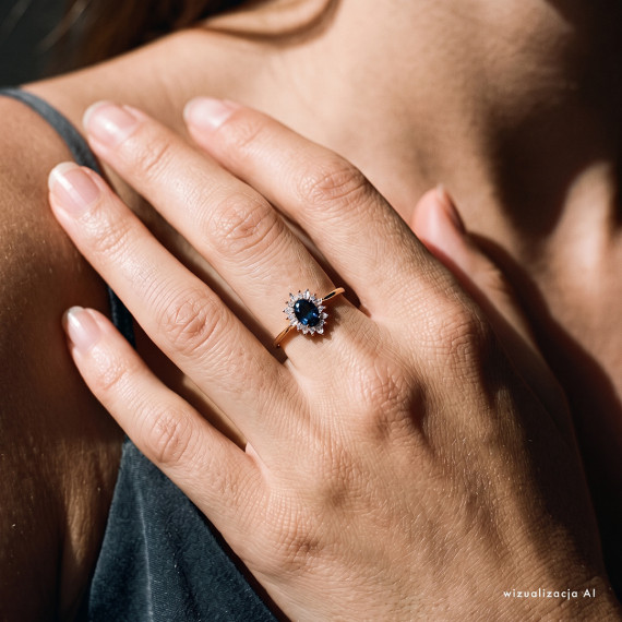 Złoty pierścionek z szafirem 0.5 ct i diamentami - próba 585 Złoty pierścionek z szafirem 0.5 ct i diamentami - próba 585
